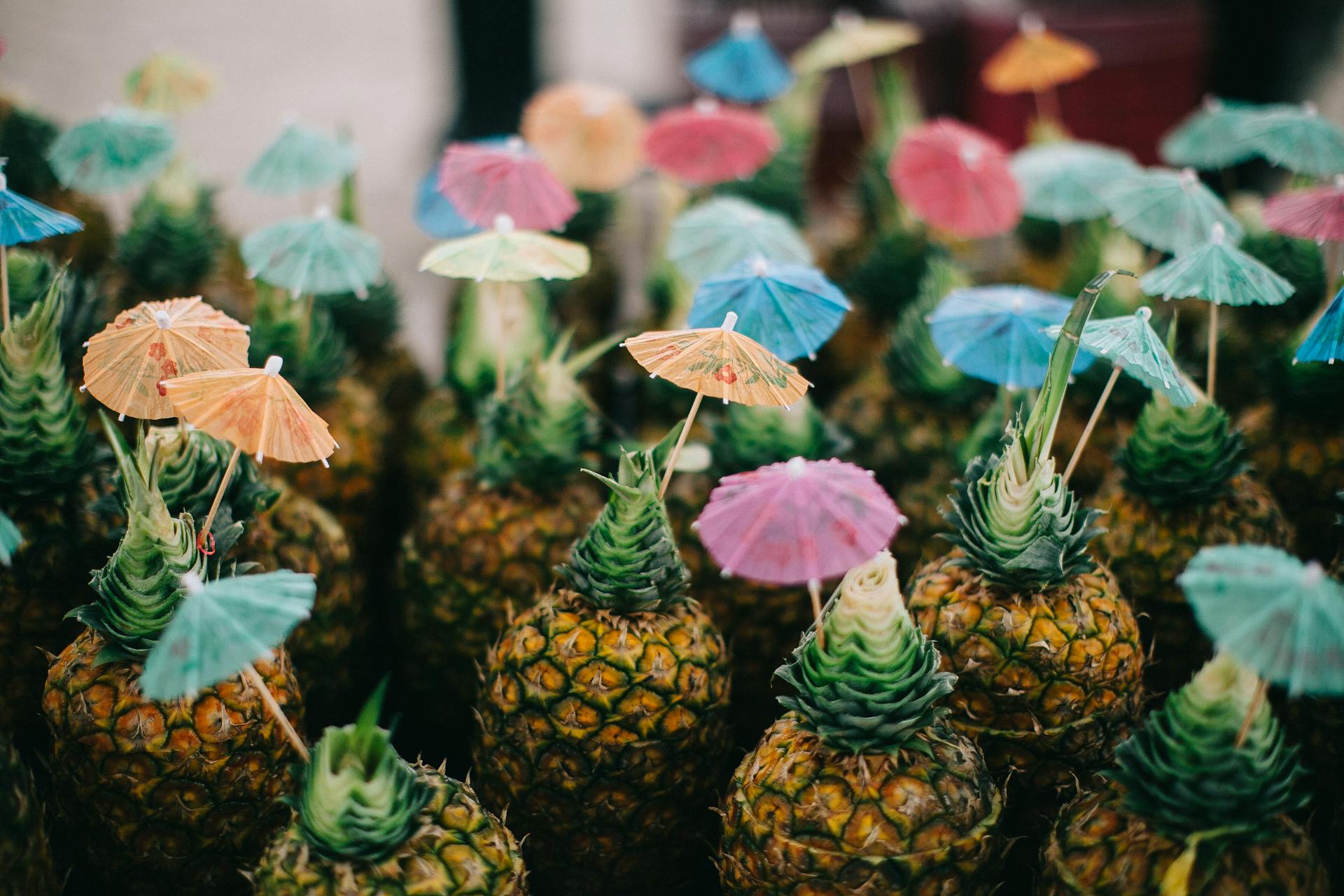 pineapples with colorful paper umbrellas